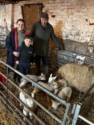 Peter Hamer, of Wood Farm, with Amelia and Jacob Hamer and their five new arrivals