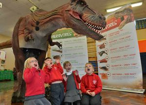 Evelyn Littleton, 5, Fraser Masters, 5, Martha Mcentee,6, and Lucas Willis, 6, with Sophie the T-rex