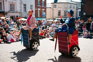 A shopping trolley race as part of the street circus in Oswestry