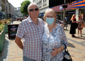 Clive and Lilian Brunjes had differing views, with Lilian saying she would keep wearing hers, while Clive said he'd take his off out doors
