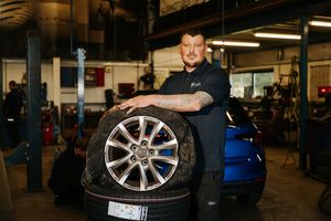 Steve Davies from Tyreworks Tyre Centre in Market Drayton with a pothole-damaged wheel.