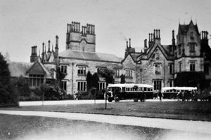 Here they come... Charabancs unload visitors in 1927.
