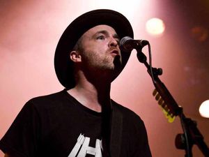 Supporting image for story: Travis lead singer Fran Healy joins rabbit farm protest