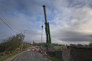  The giant crane being set up to move the beams.