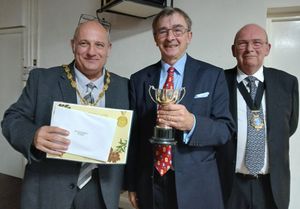 Colin Bates (centre) is presented the award for the Best Water Garden by Mayor Tim Manton (left) and Deputy Mayor Phil Glover