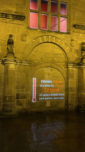 The wall at Shrewsbury Old Market Hall lit up with the climate message. Photo: Andy McKeown Lightworks
