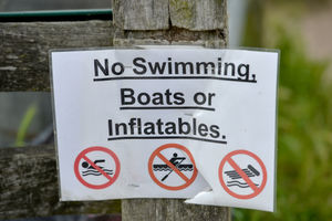 One of the signs pinned up at Chasewater warning against swimming in the reservoir 