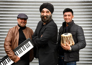 Ninder, centre, with Suki Chand and son Amar Johal who play together in bhangra group Achanak