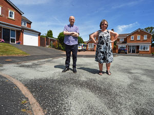 Supporting image for story: Melted asphalt leaves Telford residents unable to even walk on their cul-de-sac