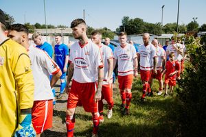 I.S.S.A FC (in white) and Majestic All Stars (in blue) take to the field