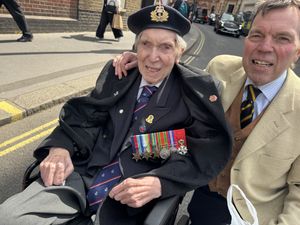 Veteran Peter Kent wearing his medals with his son Stephen