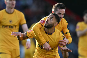 Wolverhampton Wanderers' Brazilian striker #10 Matheus Cunha (L) celebrates with Wolverhampton Wanderers' Spanish midfielder #21 Pablo Sarabia(Photo by JUSTIN TALLIS/AFP via Getty Images)          