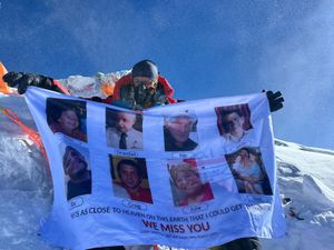 Mitch Hutchcraft reaches the summit of Mt Everest (Blue Door Productions/ Stan Gaskell/ PA)