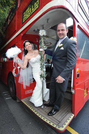 Paula and Mark Coleman leave on the bus after the wedding