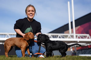 Paralympian Ellie Simmonds, newly announced in the presenting line-up for the Crufts TV show, with Cocker Spaniel puppies from West Midlands Police during the official launch of Crufts Dog Show 2025 at the NEC Birmingham. PA Photo. Photo: Jacob King/PA Wire