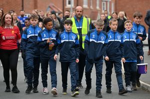 In the red Liverpool FC shirts are Mom and Dad: Kate and Chris Turton and in NC training kit is there other son: Ben Turton 11. With them also in his black Liverpool FC top is the boys cousin: Harry Ellis 16. Members of NC United joined them on the walk. 