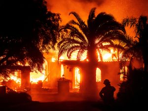 Supporting image for story: Thousands ordered to evacuate as wildfire burns homes in California