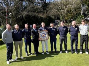 Shropshire & Herefordshire president Nigel Chesters presents the Hargrove Trophy to Shifnal B