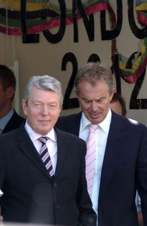 Former Britain Prime Minister Tony Blair leaves the Seven Mills School in Tower Hamlets, east London, with Education Secretary Alan Johnson in 2006