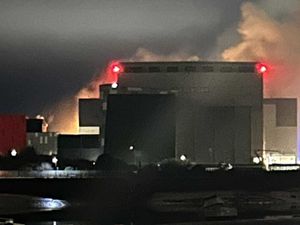 Supporting image for story: Thick smoke and bright flashes seen during fire at nuclear submarine shipyard