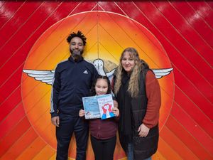 Dad Romero Bernard, daughter Marnie with her winning entry, and mum Nicola Restall.