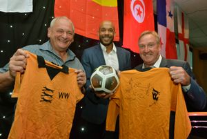 Former Wolves players Steve Kindon (left), Matt Murray (centre) and Steve Daley (right) show off the Wolves-themed raffle prizes. 