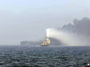 Smoke billowing into the air after a crash between an oil tanker and a cargo ship off the coast of East Yorkshire (Bartek Smialek)