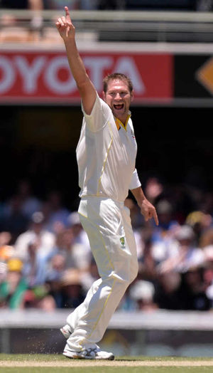 Australia's Ryan Harris celebrates
taking the wicket of England's Alastair Cook