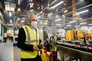 Site director John Parkes focusing on draw string bags
