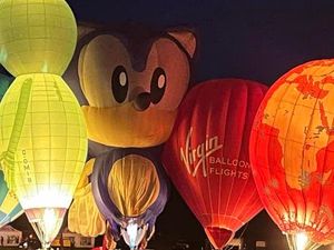 Supporting image for story: Balloons light up Telford's night sky as a Lancaster and Red Devils set to fly in