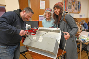At the Repair Cafe are Rob Wix, Jood Gough and Hannah Peters