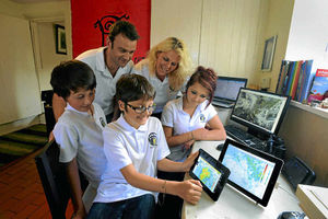 The family check the weather on computers at their home near Bridgnorth