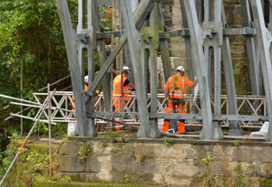 Workers erecting scaffolding on the Iron Bridge
