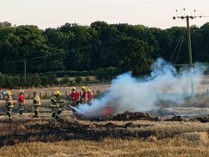 Firefighters tackle a large fire in the open. Picture: SRFS.