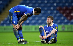 Adam Webster (right) as he sits injured 