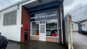 Temporary servicing department located opposite sales office.