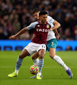 Aston Villa's Ollie Watkins and Manchester City's Ruben Dias (right) battle for the ball 