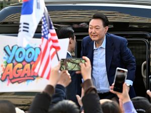 Supporting image for story: Ousted South Korean leader greets supporters as he leaves presidential residence