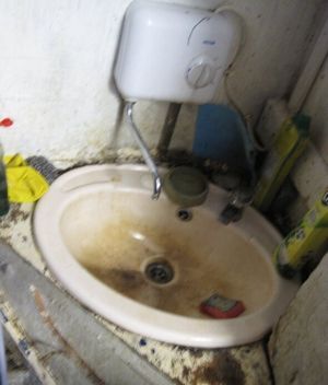 A dirty sink found at the premises