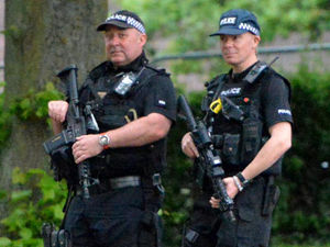 Armed police on patrol at the Let's Rock 80s Festival in the Quarry, Shrewsbury in 2017