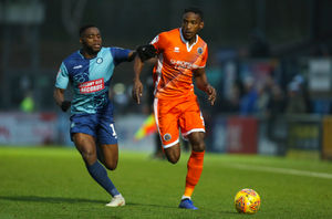 Fred Onyedinma of Wycombe Wanderers and Omar Beckles of Shrewsbury Town