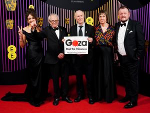 Supporting image for story: Veteran filmmaker Ken Loach poses at Baftas with sign calling for Gaza ceasefire