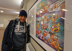 Darren Parkes shows off some of his work at the exhibition