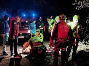 Rescuers on the site where a cable car south of Naples crashed.