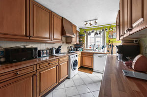 The rear kitchen offers excellent scope for redesign, with potential to create a modern open-plan kitchen-diner