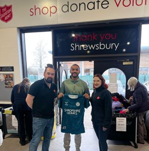 Funso Ojo meets staff and volunteers at the Salvation Army shop in Shrewsbury