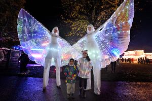Zayyan Khan and Amirah Khan from Wolverhampton with two angelic stilt walkers 