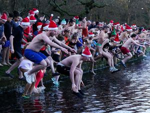 Supporting image for story: In Pictures: Hardy swimmers and royal watchers brave cold Christmas Day