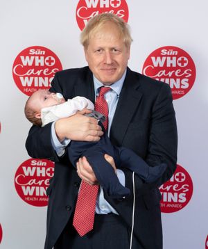 Prime Minister Boris Johnson with baby Logan. Photo: Dan Charity - The Sun.