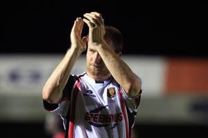 Kelvin Langmead of Shrewsbury Town applauds the fans at the end of the match